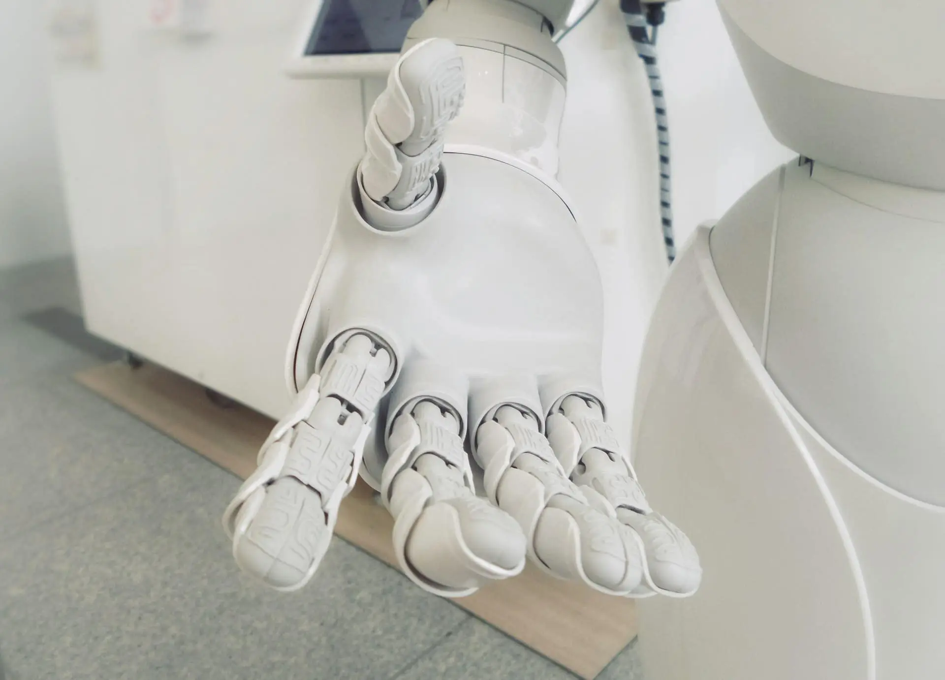 Robotic hand representing AI inside business software